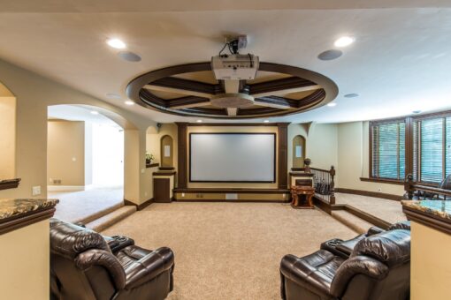 Brandywine home theater with ceiling medallion and screen