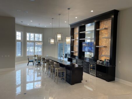 Shire lower-level bar with lit display shelving