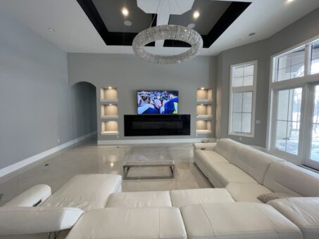 Shire lower-level lounge with sectional and media wall