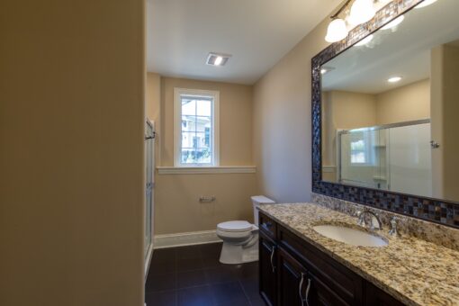 Rivendell bathroom with dark vanity and mirror