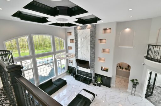 Woodland great room with linear fireplace and lit niches