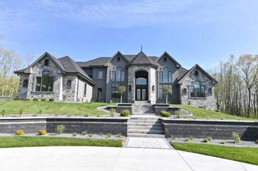 Woodland front elevation with terraced stone walls and steps