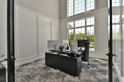 Woodland home office with two-story windows