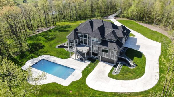 Woodland aerial view with pool and wooded lot