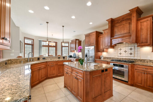 Benington kitchen with cherry cabinetry and curved island