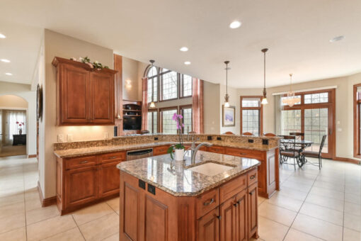 Benington kitchen with cherry cabinetry and granite island