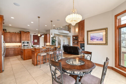 Benington kitchen and breakfast area with cherry cabinetry