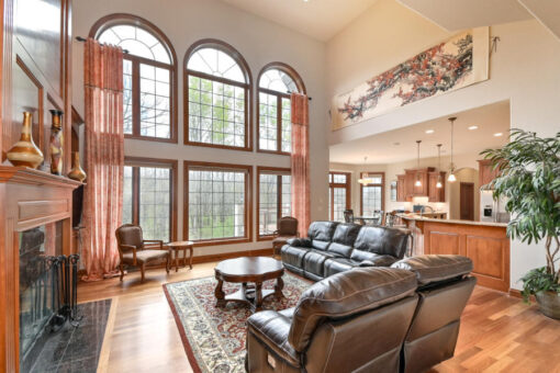 Benington great room with arched window wall and balcony