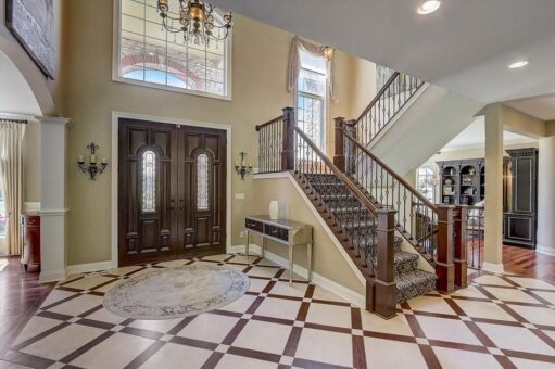 Talon foyer with double entry doors and staircase