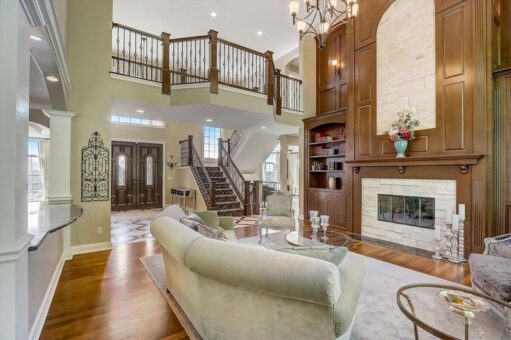 Talon two-story great room with fireplace and balcony