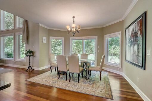 Talon breakfast area with chandelier and windows
