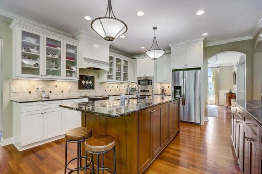 Talon kitchen with white glass-front cabinetry