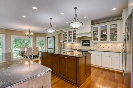 Talon kitchen with wood island and white cabinetry