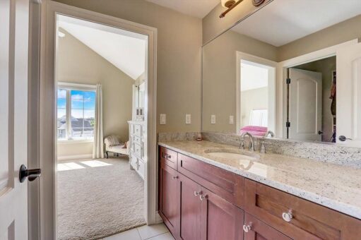 Talon bathroom with wood vanity and granite