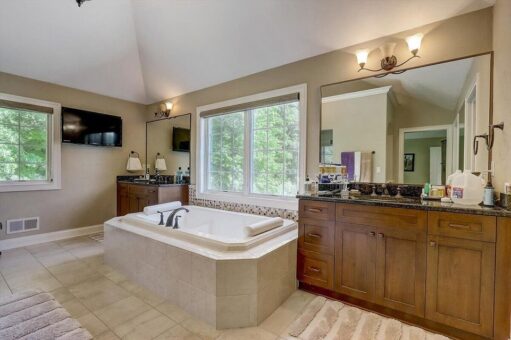 Talon primary bath soaking tub and wood vanity