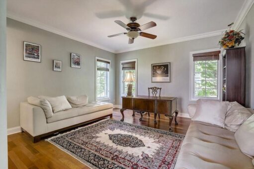 Talon bedroom with sitting area and ceiling fan