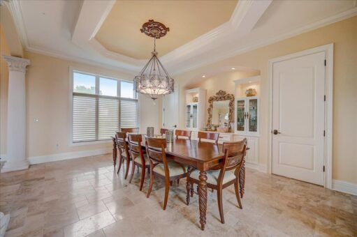 Edington dining room with chandelier and window wall