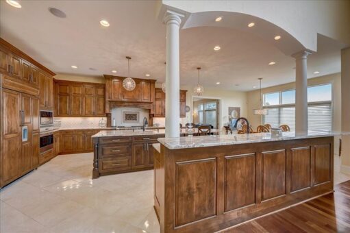 Edington kitchen island with column and wood cabinetry