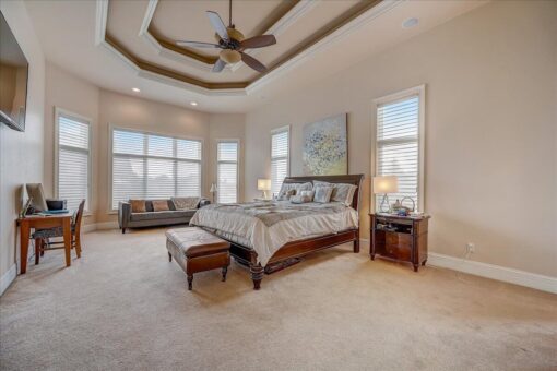 Edington bedroom with tray ceiling