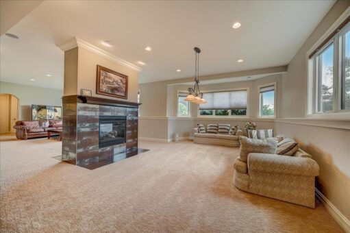 Edington lower-level fireplace with stone surround