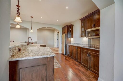 Edington lower-level kitchen with wood cabinetry