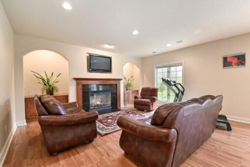 Benington lower-level family room with fireplace