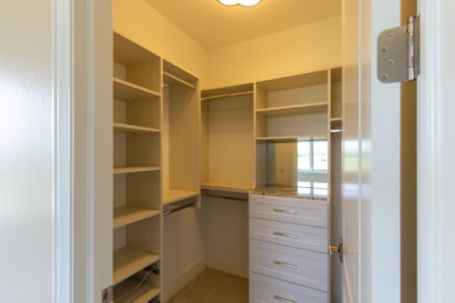 Stone Creek walk-in closet with white shelving