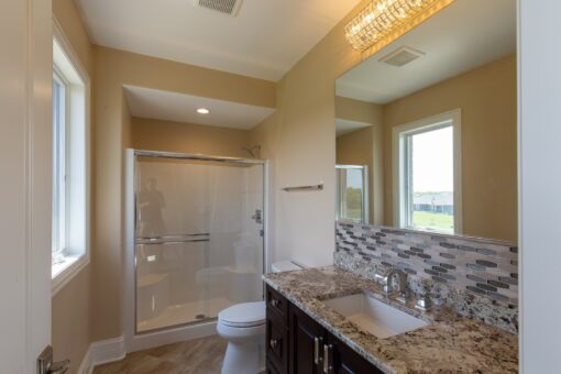 Stone Creek bathroom with tub and dark vanity