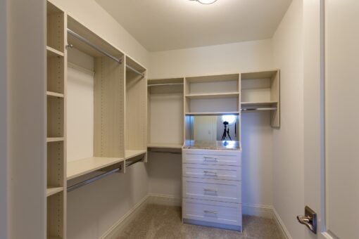 Stone Creek walk-in closet with white built-ins