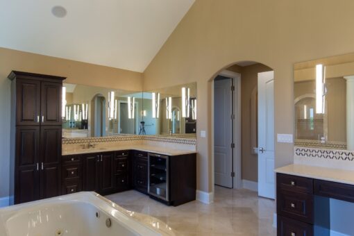 Stone Creek primary bath dark vanity and tub