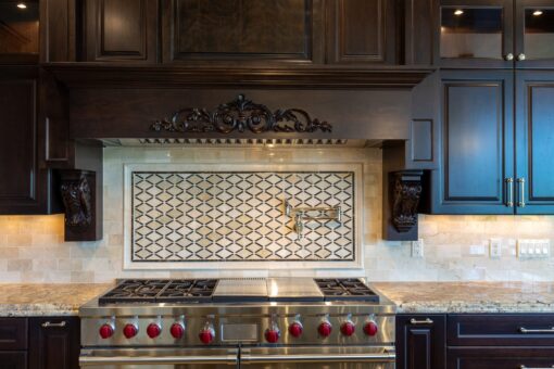 Stone Creek kitchen professional range with mosaic tile backsplash