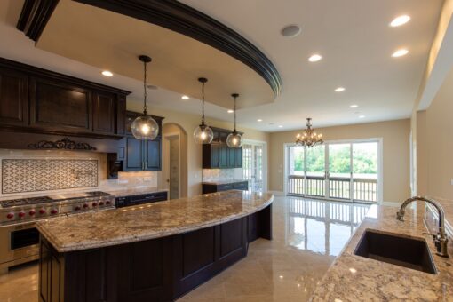 Stone Creek kitchen with curved granite island