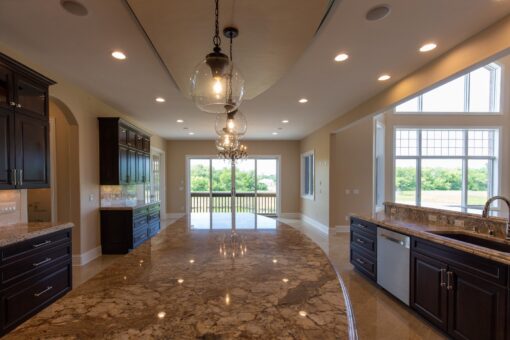 Stone Creek kitchen with curved ceiling detail and window