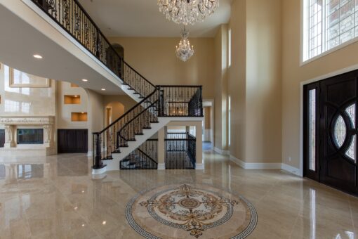 Stone Creek foyer staircase and balcony with lit niches