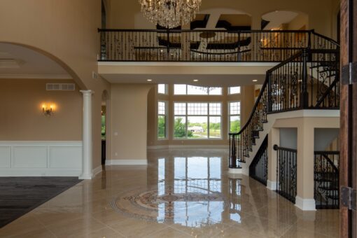 Stone Creek two-story foyer with inlaid marble medallion