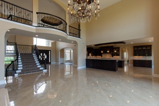 Stone Creek foyer with balcony and crystal chandelier