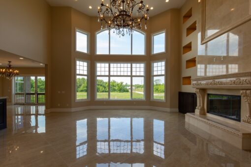 Stone Creek great room with window wall and lit niches