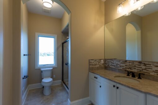 Stone Creek bathroom with white vanity and window