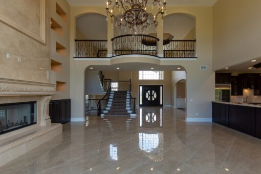 Stone Creek great room view to the foyer staircase and balcony