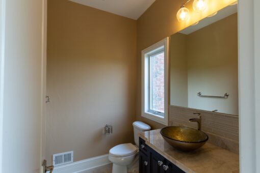 Stone Creek powder room with vessel sink