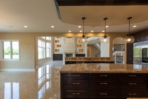Stone Creek kitchen with dark island and tray ceiling