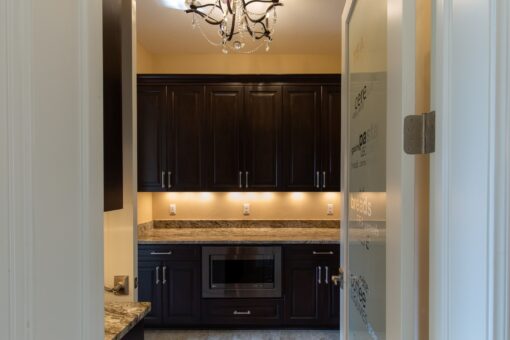 Stone Creek butler's pantry with under-cabinet lighting