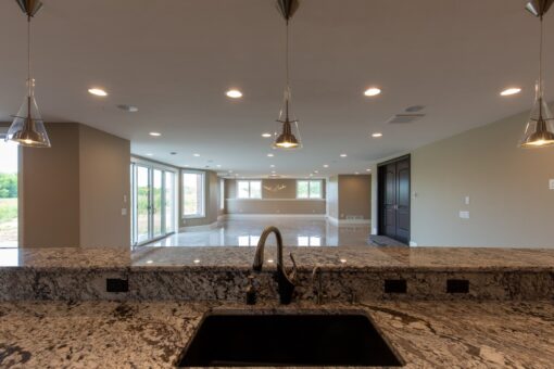 Stone Creek lower-level kitchen sink with granite counters