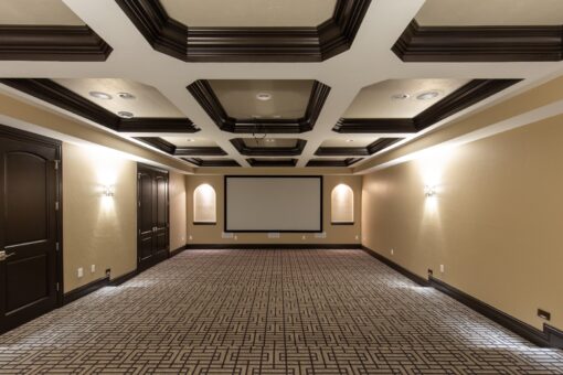 Stone Creek lower-level home theater with coffered ceiling