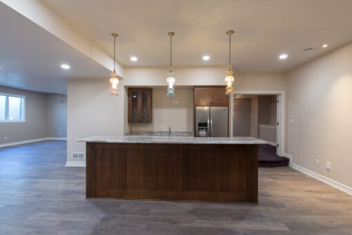 Auburn lower-level kitchen island with pendants