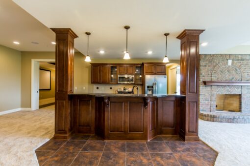 Richland lower-level kitchen with wood columns and pendant lights