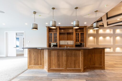 Birchwood lower-level bar with glass-front cabinets