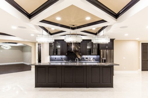 Saddlebrook lower-level kitchen island with dark cabinetry