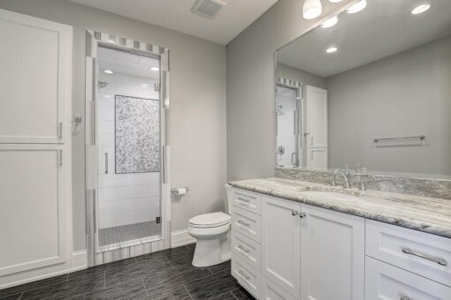 Wildwood bathroom with white vanity and glass shower