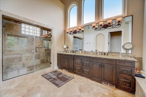 Edington primary bath with arched windows and long vanity